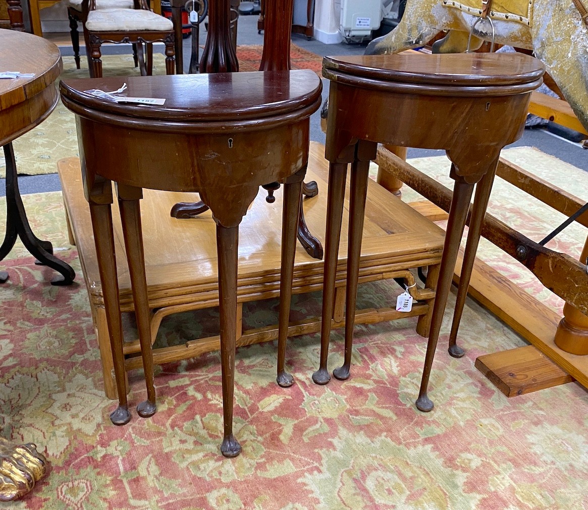 A near pair of small George II style red walnut D shaped folding tea tables, width 45cm, depth 22cm, height 74cm